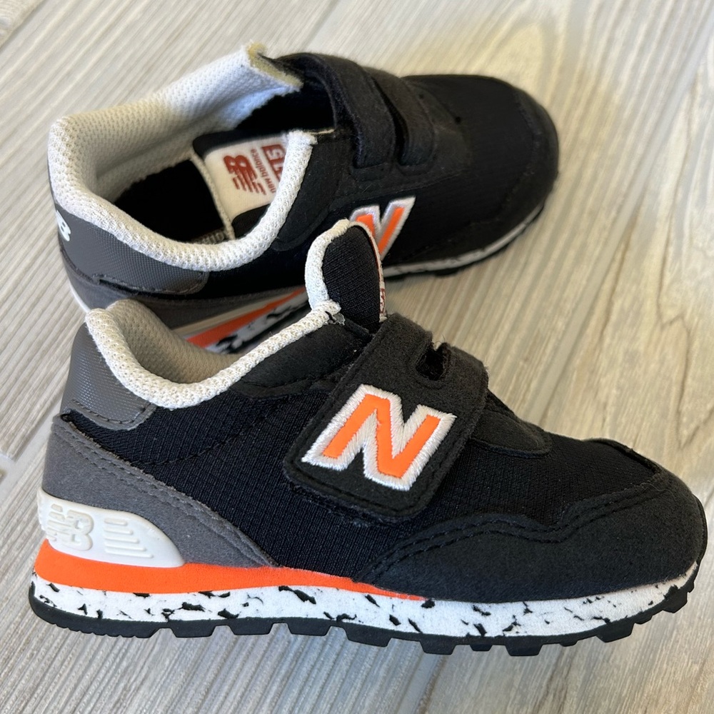 Black and orange new balance toddler tennis shoes size 6